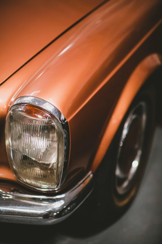 a closeup of a very old fashioned car headlight