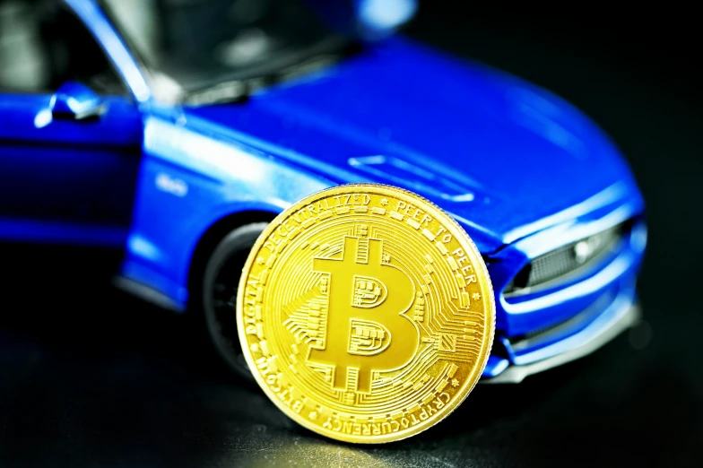 the bitcoin on a car is sitting in the road