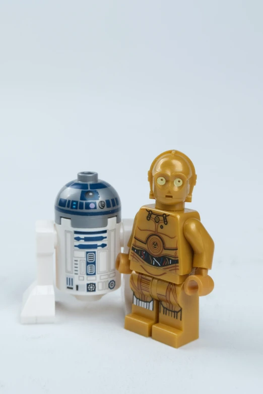 a lego character and droid toy, possibly in star wars