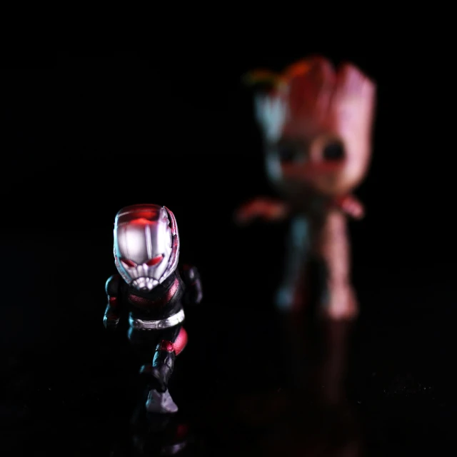 a red - colored toy looks like an iron man