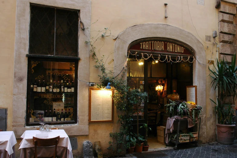 an outside s of an empty table, outside a wine bar