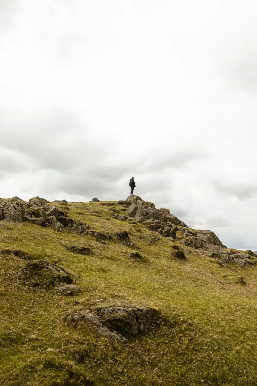 a person standing on top of a hill