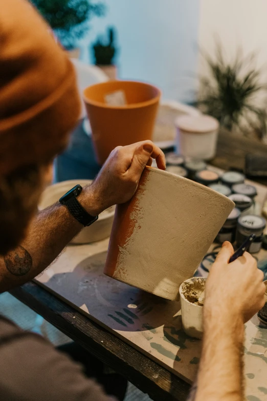 a man is at the table working on a book