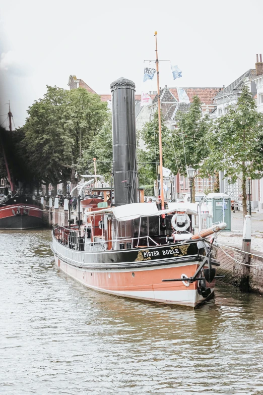 a large boat on the side of the river