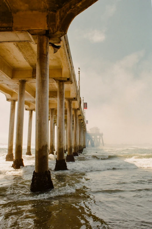 a long pier that has many pillars on top of it