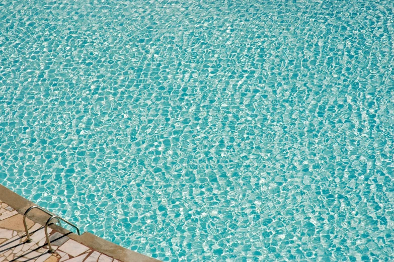 the bottom of a swimming pool with a blue sky