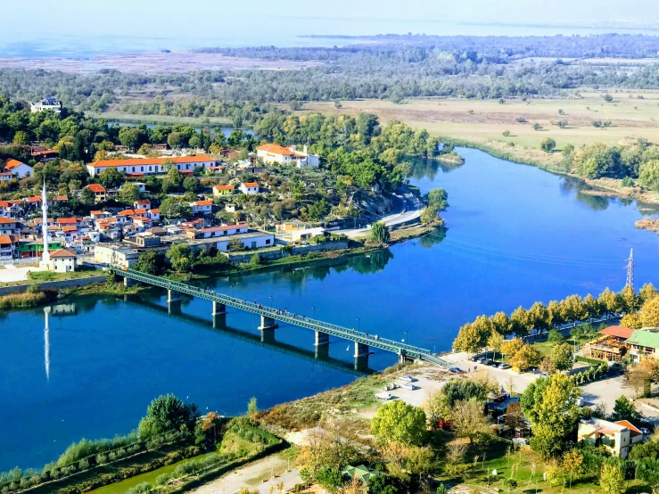 an aerial view of a village in the middle of water