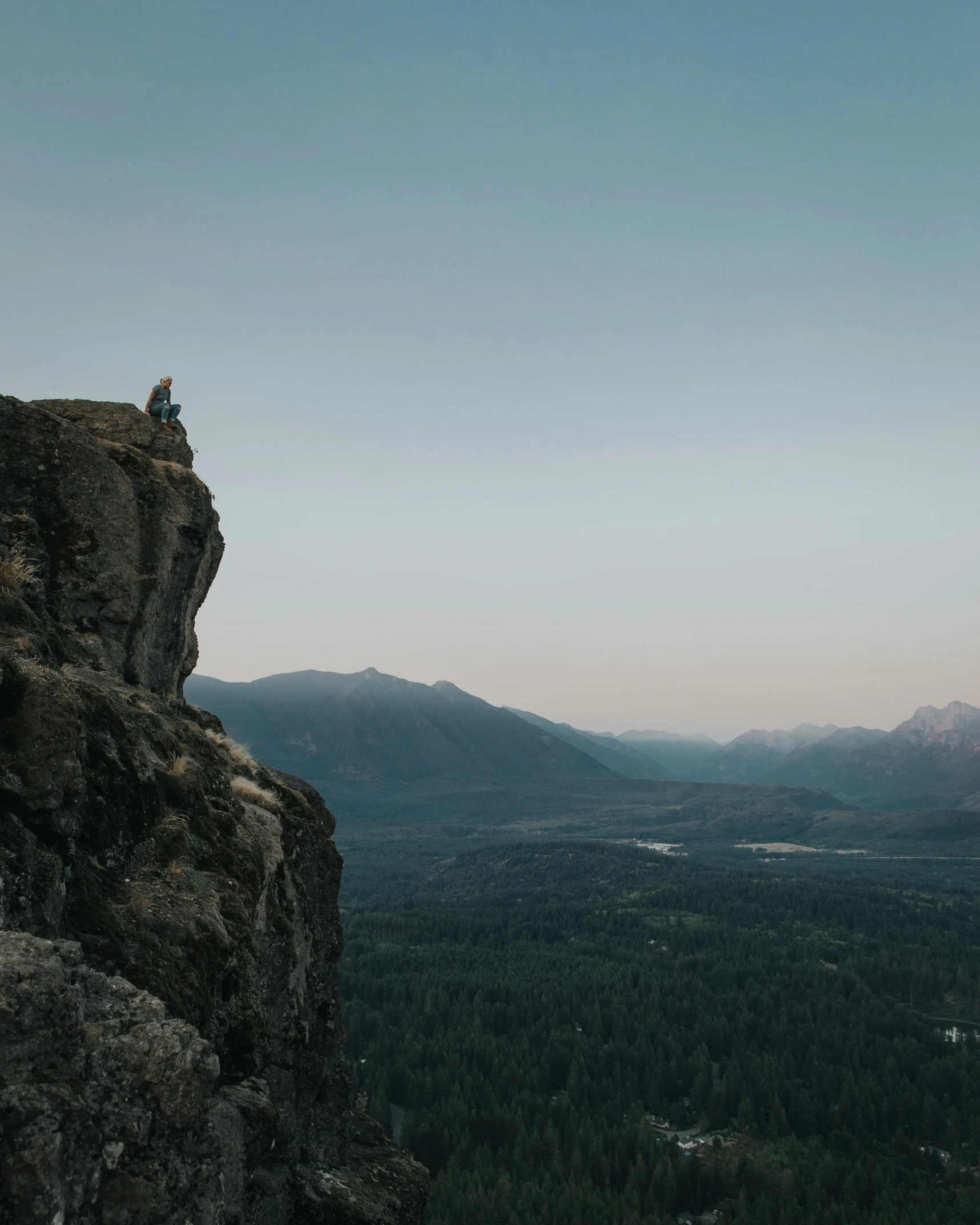 an image of a person that is sitting on a rock