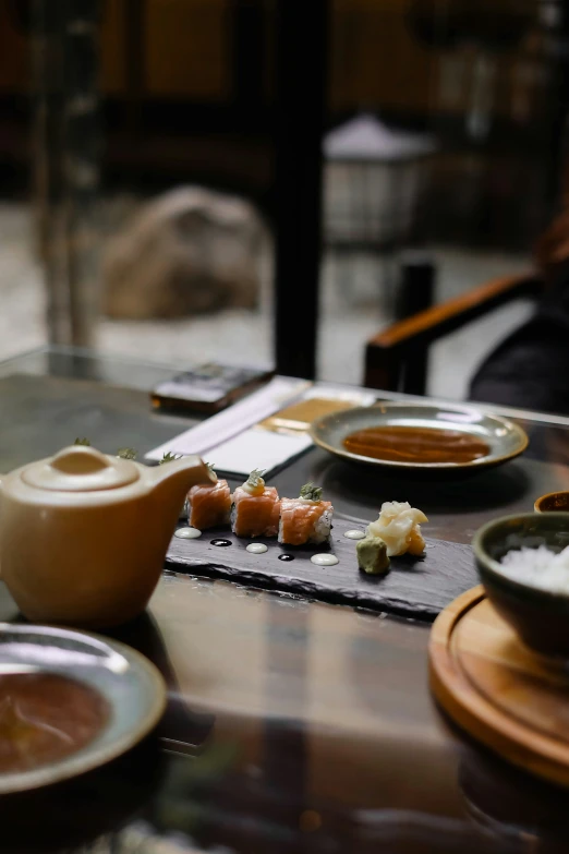 a table filled with plates of food on it