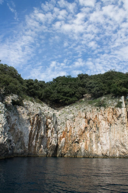 a very large rocky outcrop in a forest