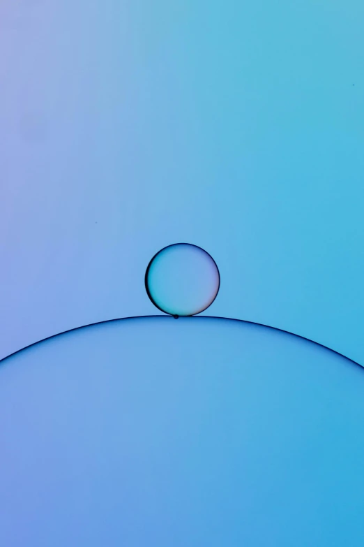 a picture with an oval shape on a light blue background