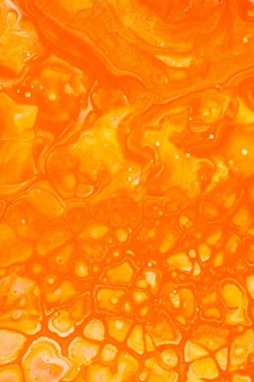 a yellow liquid and orange substance in water