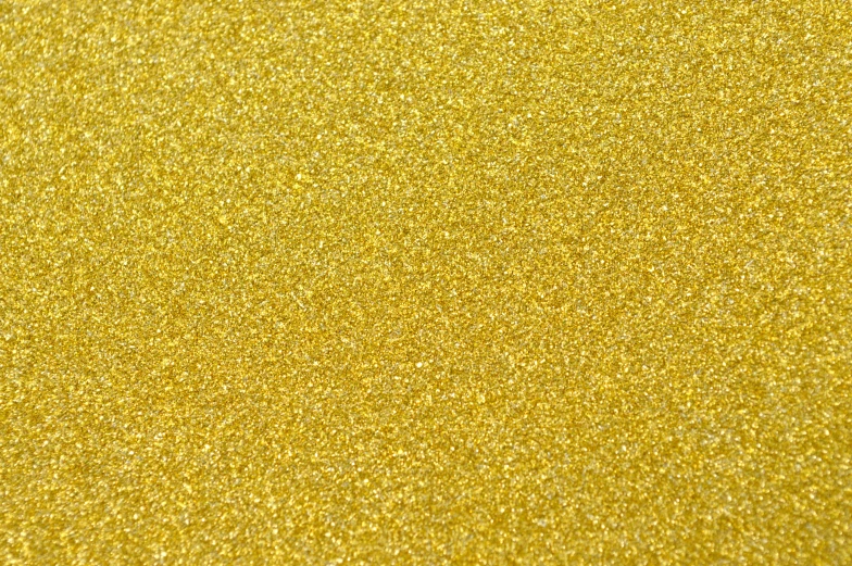 the surface of a glitter paper is yellow