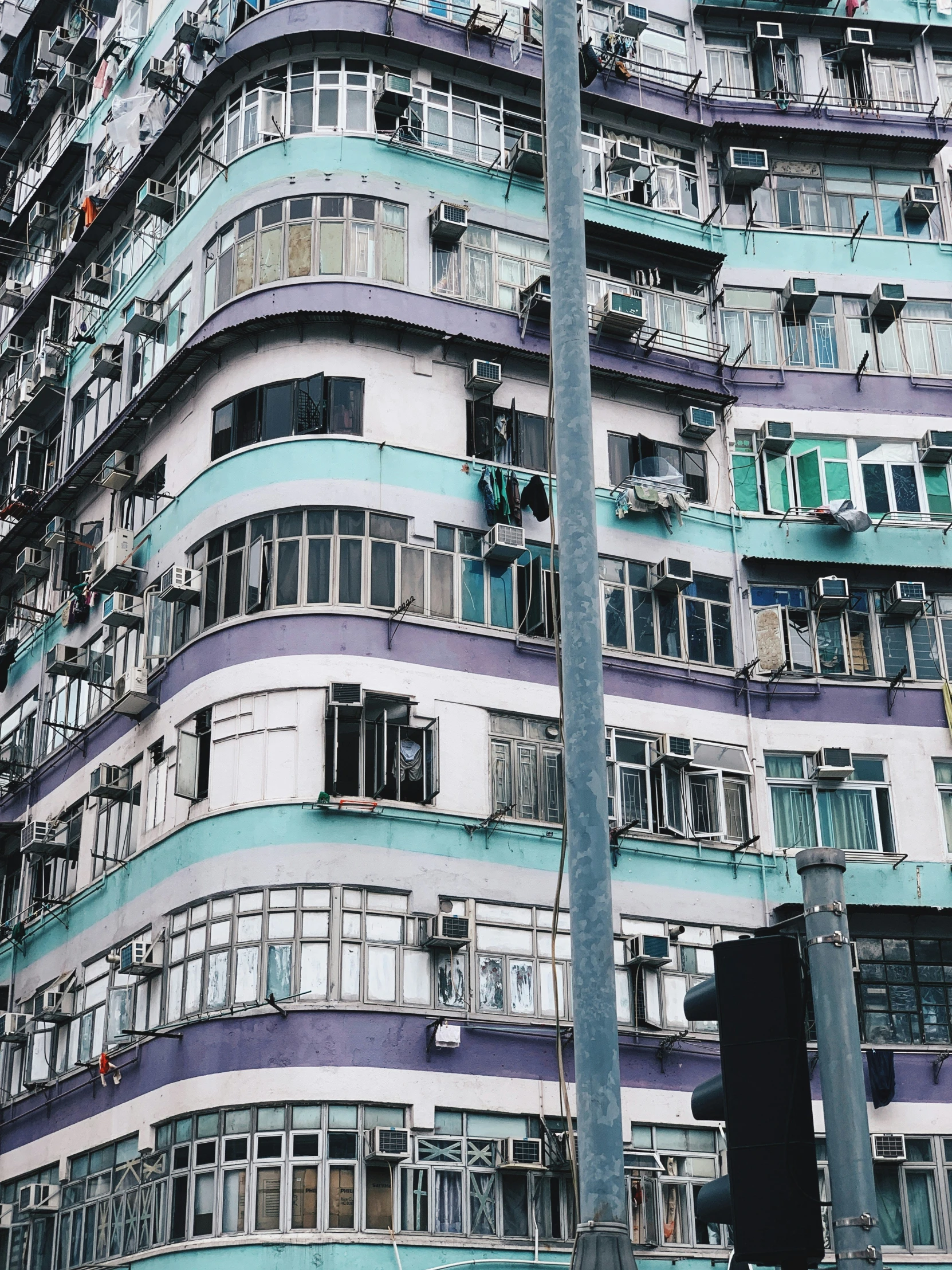 an apartment building with many windows and balconies