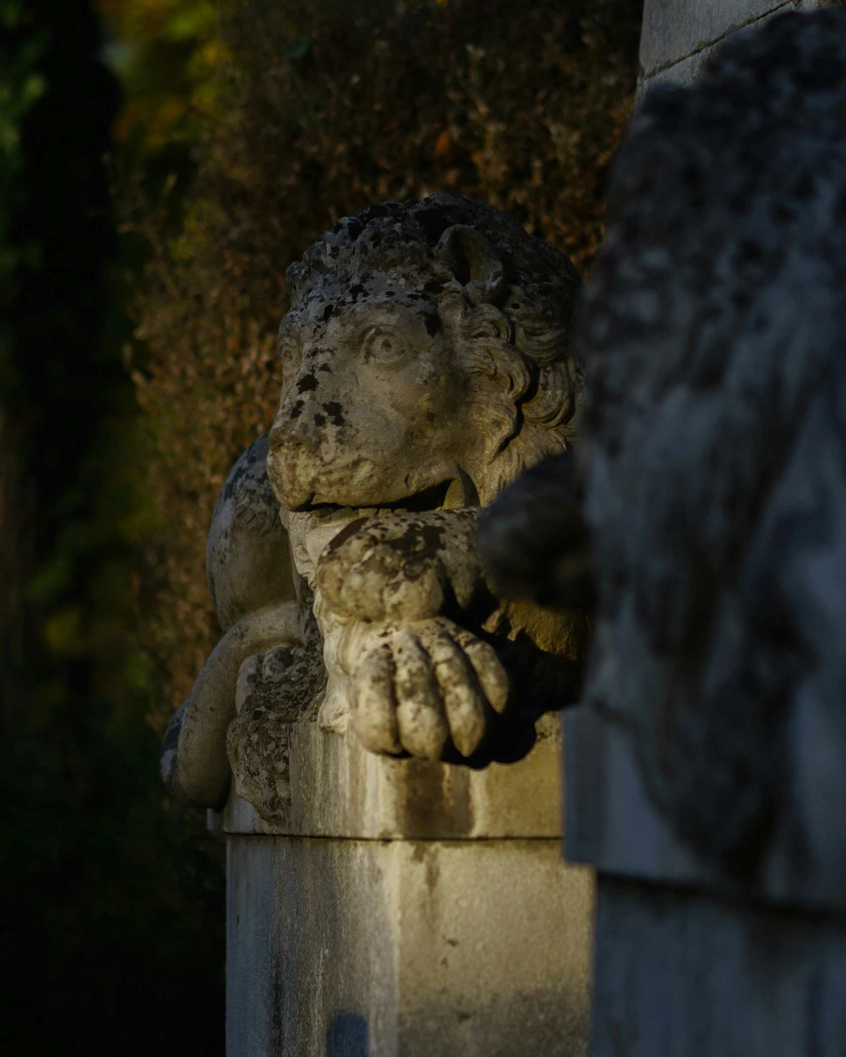 a statue in the middle of a cemetery