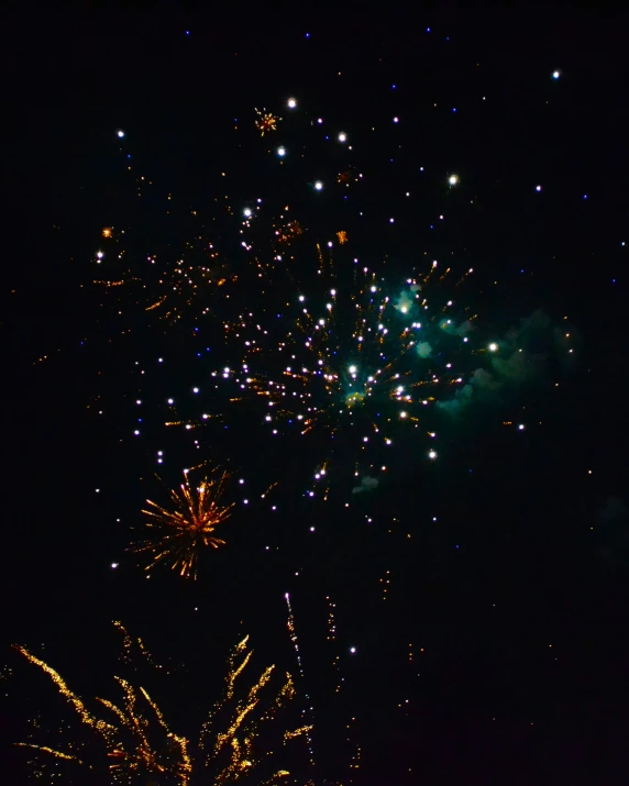 fireworks are lit up in the night sky