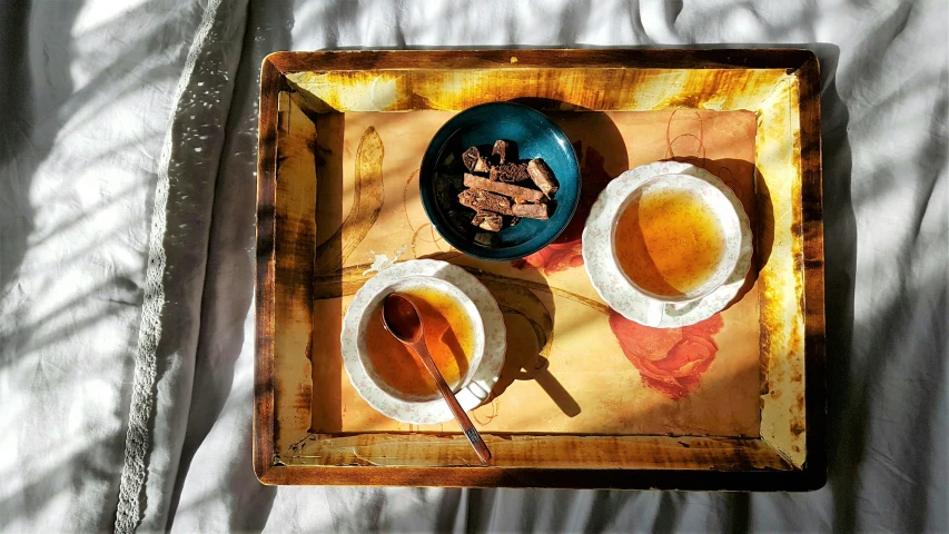 a bowl of tea on a small tray