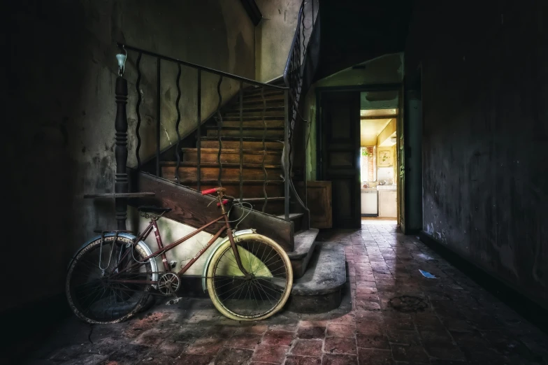 a bicycle leans against a railing next to a staircase