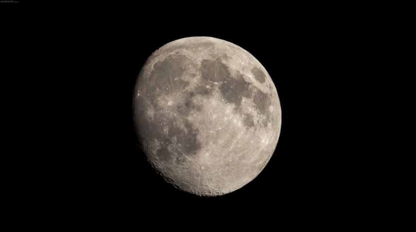 a black - and - white pograph of the moon in full light