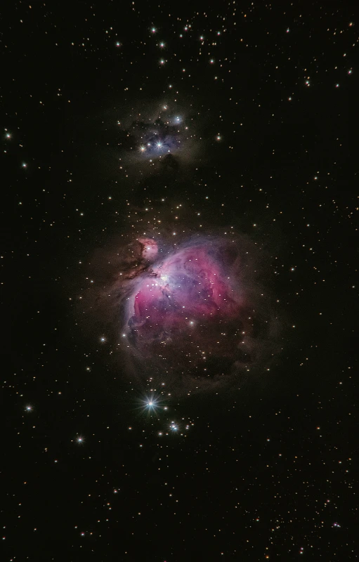 a big pink object in a big dark night sky