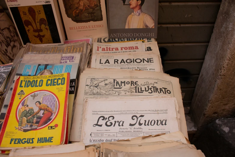 old newspapers sit on top of each other