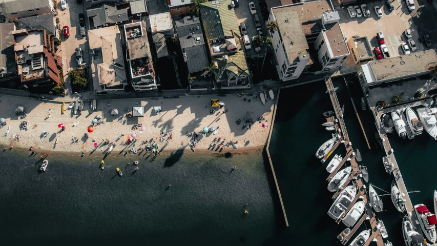 several boats docked in a harbor next to a city