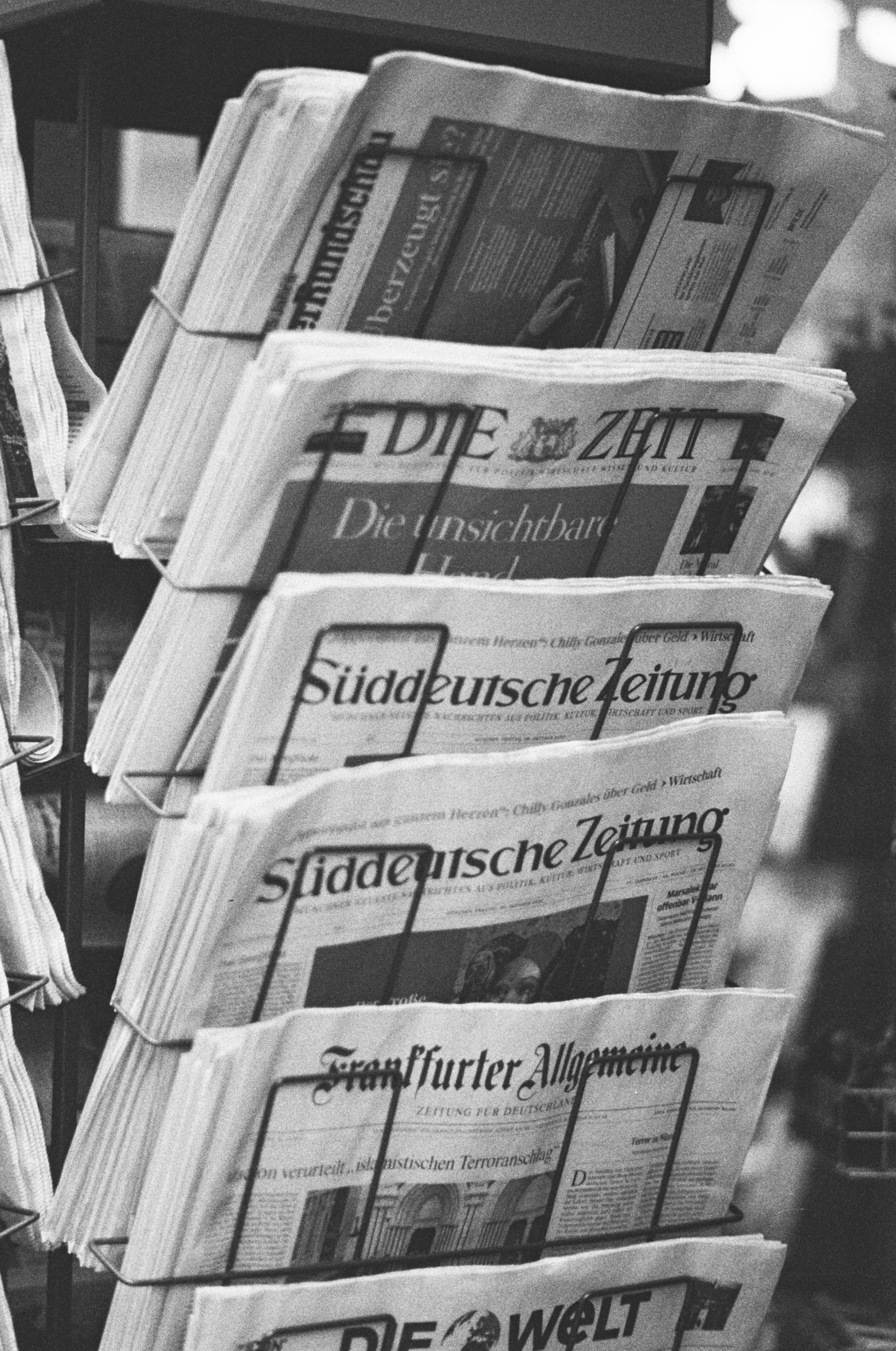 many newspapers stacked up to form a stack