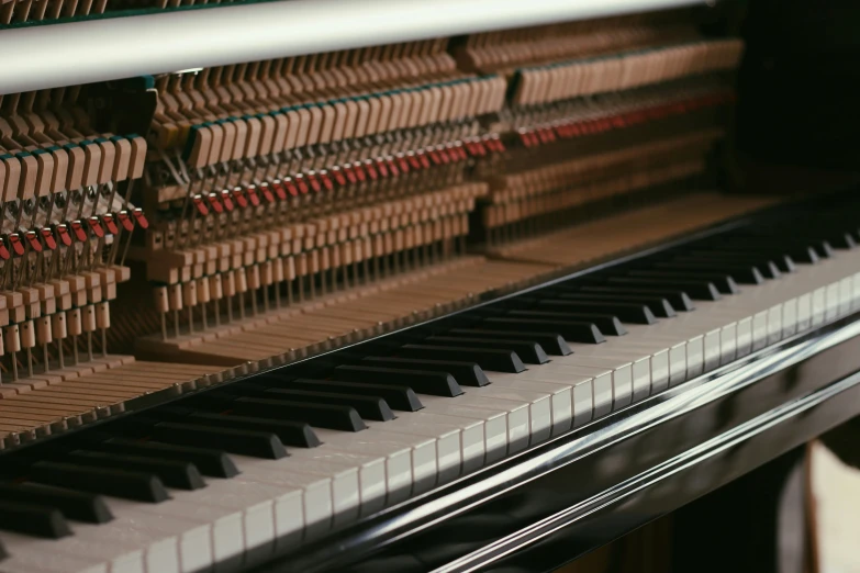 an ornate piano with wood and red decoration