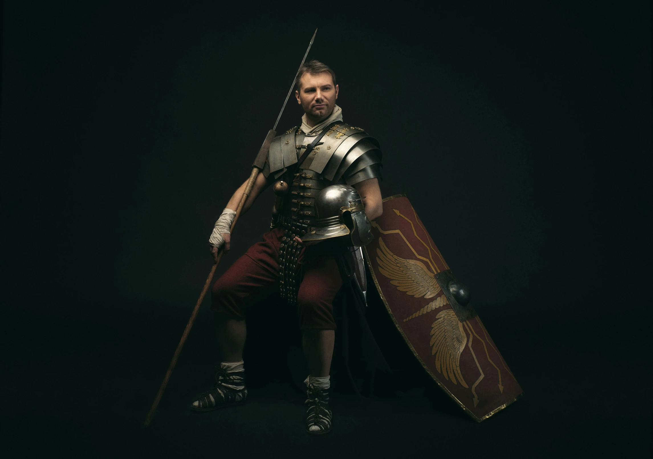 a man in armor and holding a sword