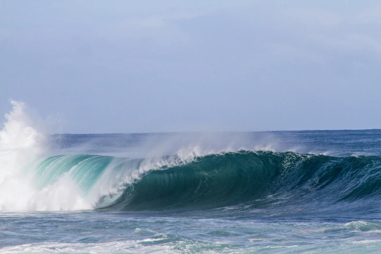 a person is surfing a big wave on the ocean