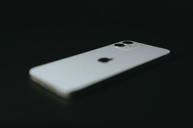 a cell phone is lit up on a table