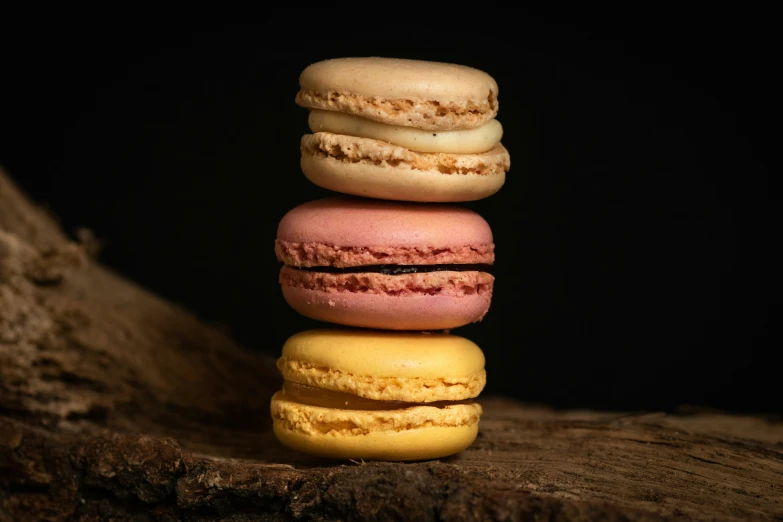 a stack of multicolored macaroons sitting on top of each other