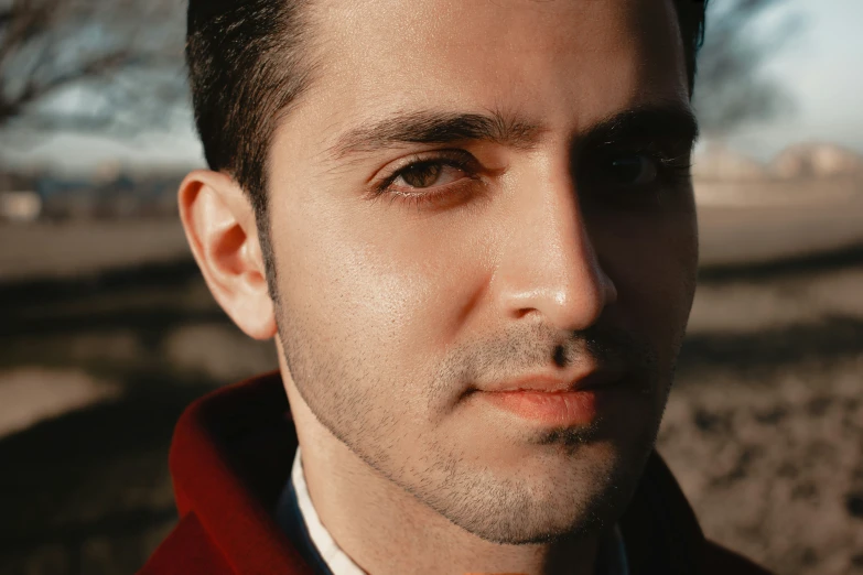 man wearing orange tie staring to camera at the pographer