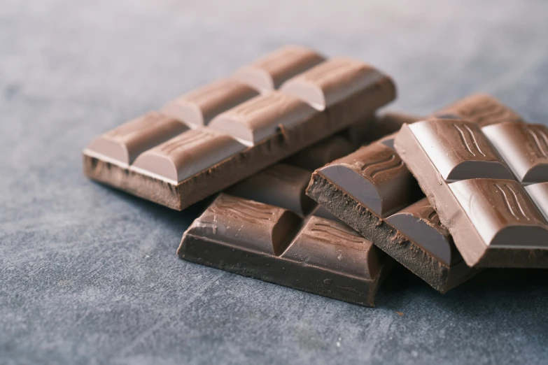 a group of chocolate bars laying on top of each other