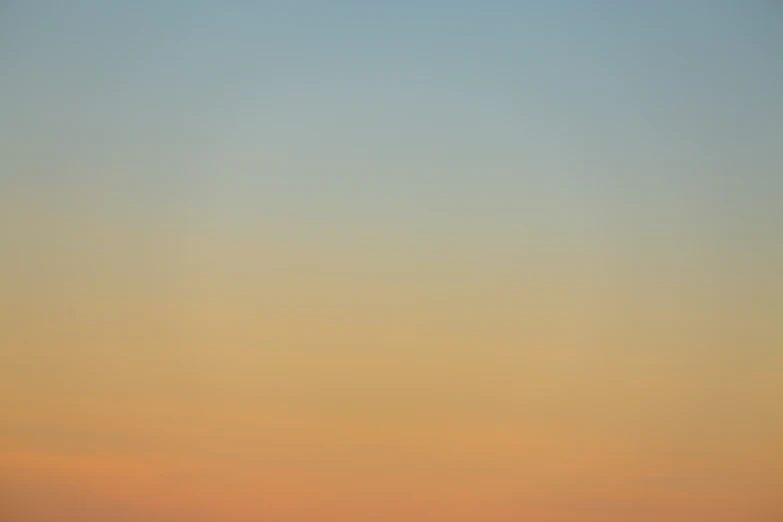 three planes flying in the air at dusk