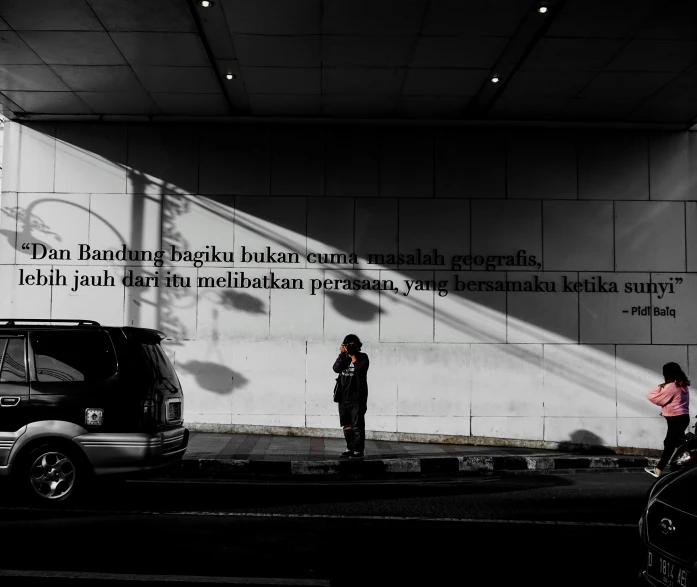 two people standing in front of an empty building