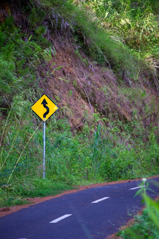 an intersection at a road with a one way sign