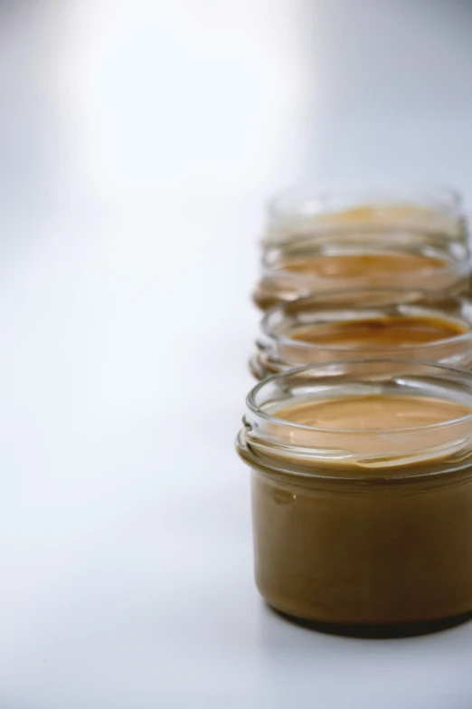 small jars are full of brown powder