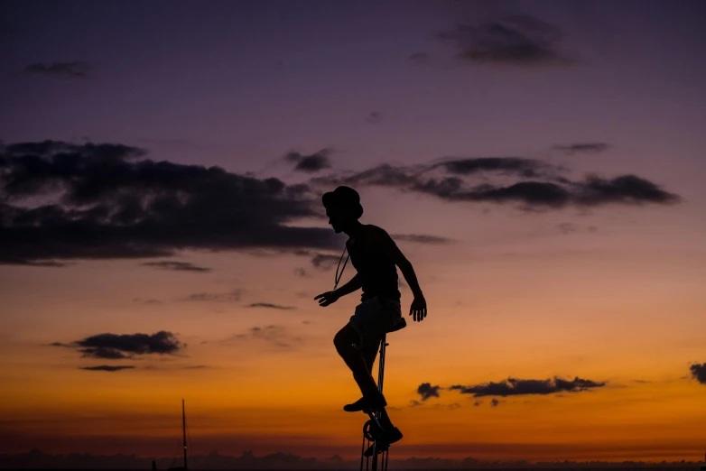 a person that is on a surfboard in the sky