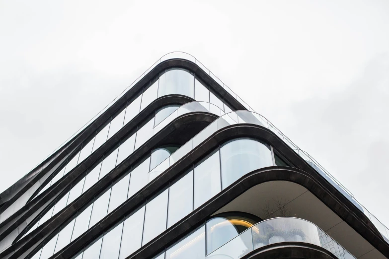 the top of a black and white building with windows