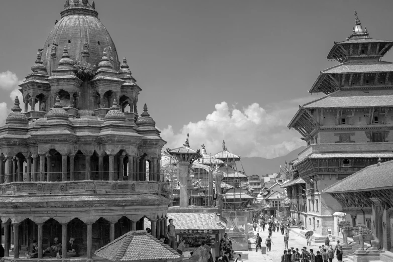 an ancient town with a temple and steeple on top