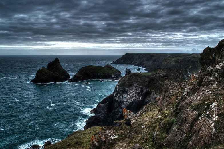 there is a large rocky shore near the water