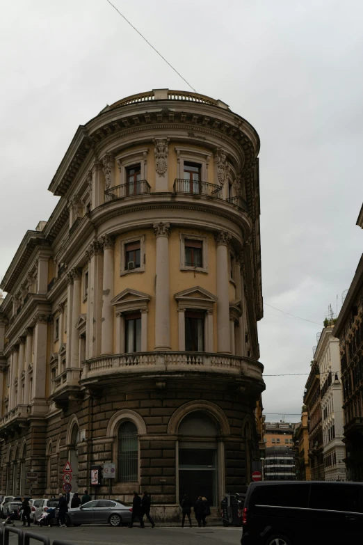 large ornate building next to a busy street