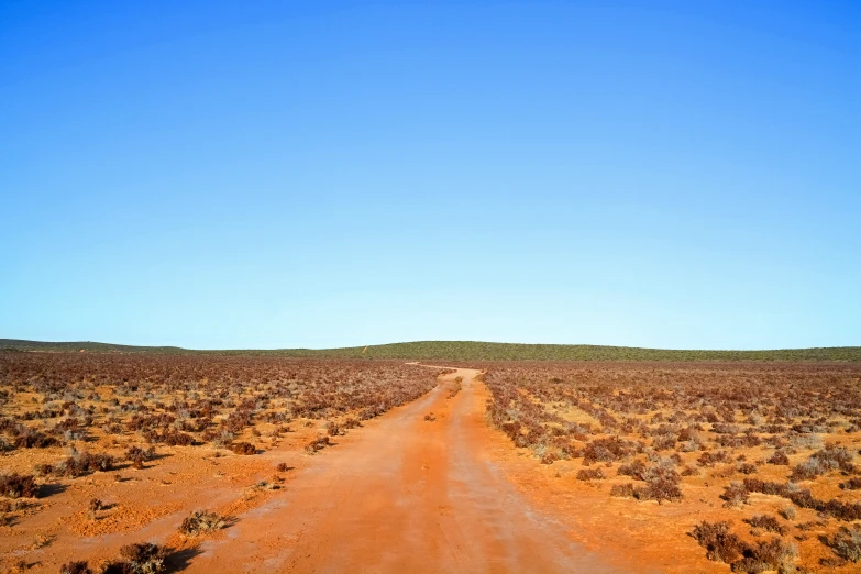 the large road runs through a desert land