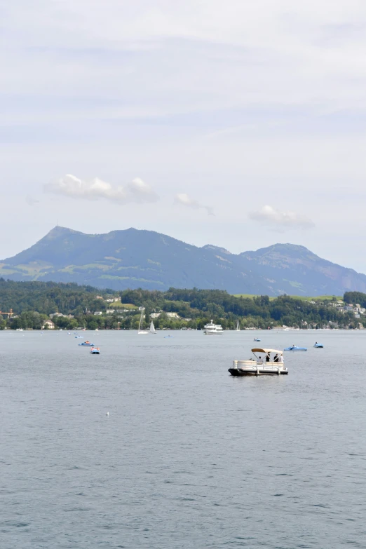 a large body of water with a boat floating in it