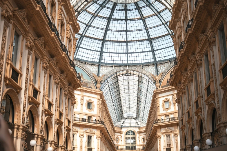 an atrium of a building with glass ceilings