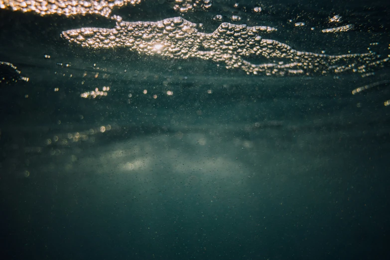 some water in the ocean, with bubbles and bubbles