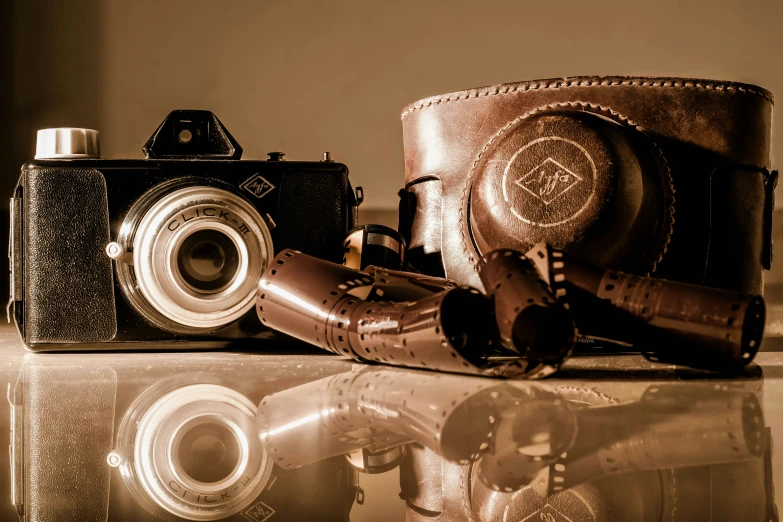 vintage cameras displayed on shiny surface with reflection