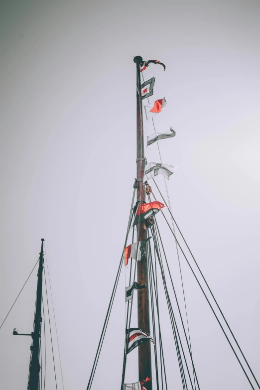 a black and white po of the mast of a boat