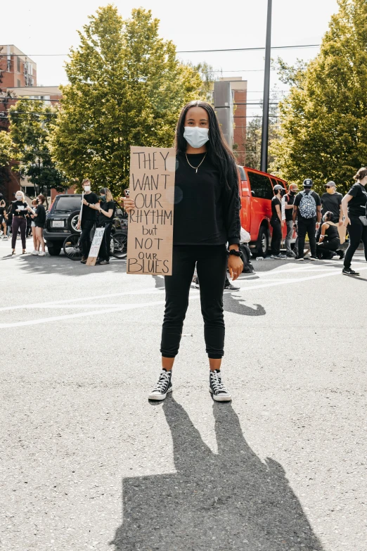 a person holding a sign that says, don't feed me here